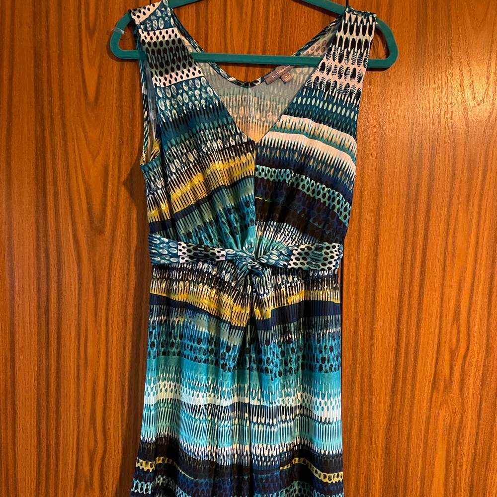 Multi colored sleeveless dress. Ties in the back. Stretchy material.